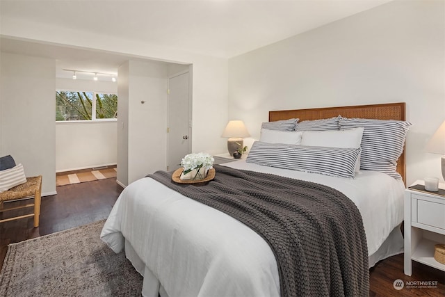 bedroom featuring dark hardwood / wood-style flooring