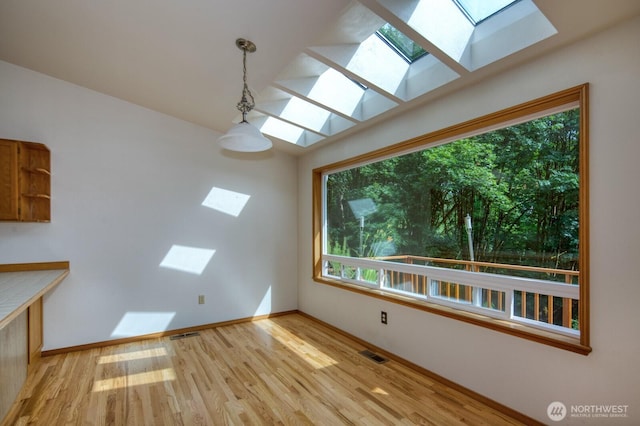 8917 SE Mcbreen Ln, Port Orchard, WA 98367 - unfurnished room with a skylight and light wood-style flooring