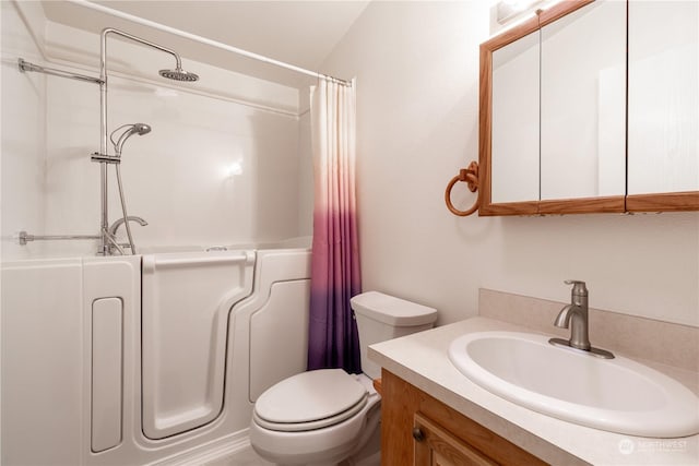 bathroom featuring toilet, vanity, vaulted ceiling, and curtained shower