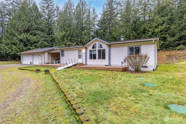 view of front facade featuring a front lawn and a garage