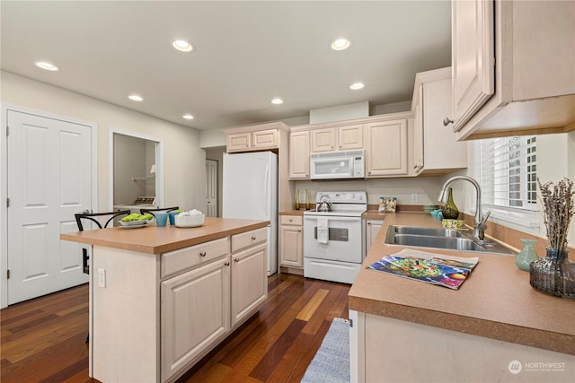 kitchen with white appliances, dark wood-type flooring, a center island, and sink