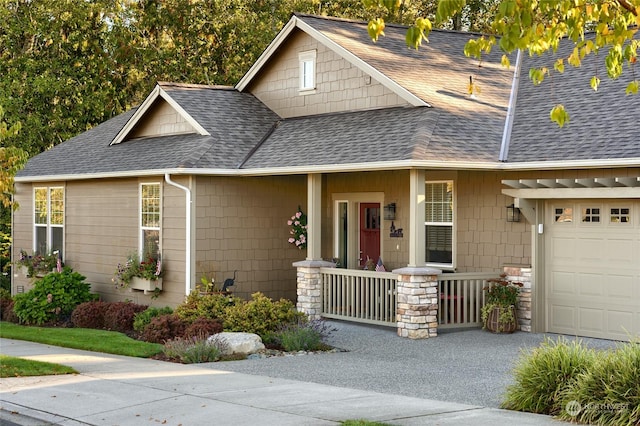 view of front of house with covered porch and a garage