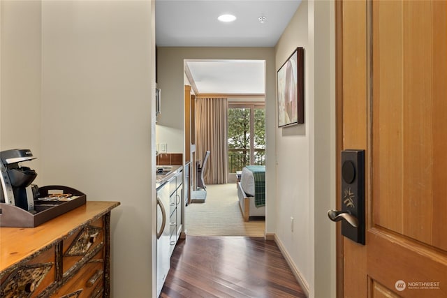 hallway featuring dark wood-type flooring