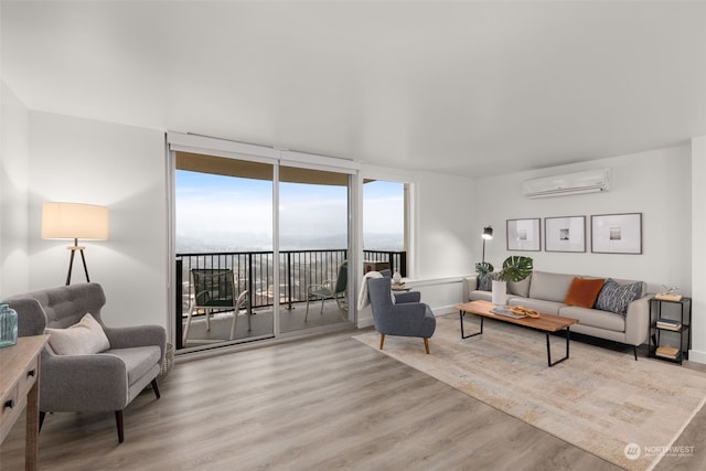 living room featuring light wood-type flooring, a wall of windows, a water view, and an AC wall unit