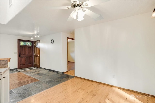 foyer featuring dark hardwood / wood-style flooring and ceiling fan