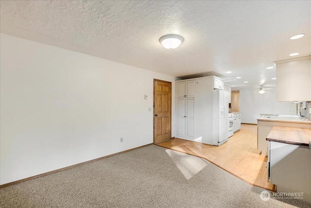 interior space with sink and a textured ceiling