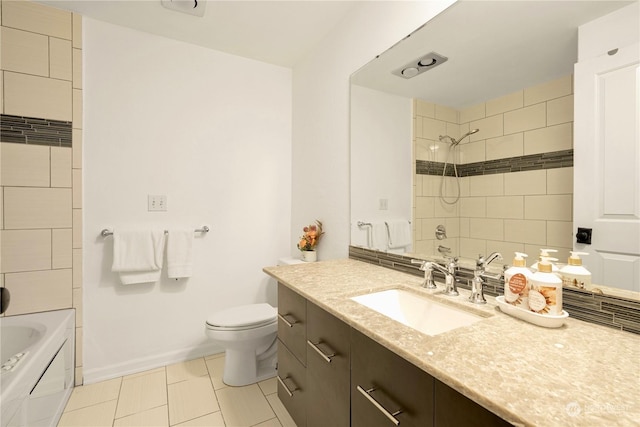 full bathroom with toilet, baseboards,  shower combination, and vanity