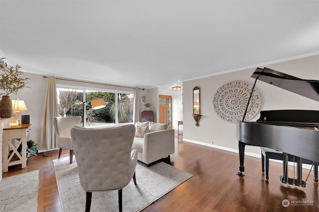 living room with ornamental molding and hardwood / wood-style flooring