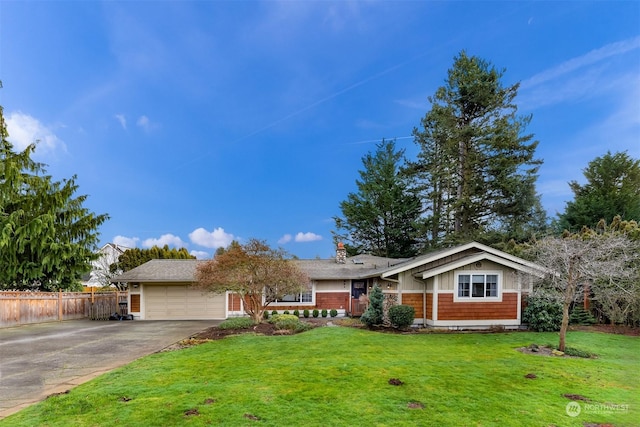 ranch-style house featuring a front lawn and a garage