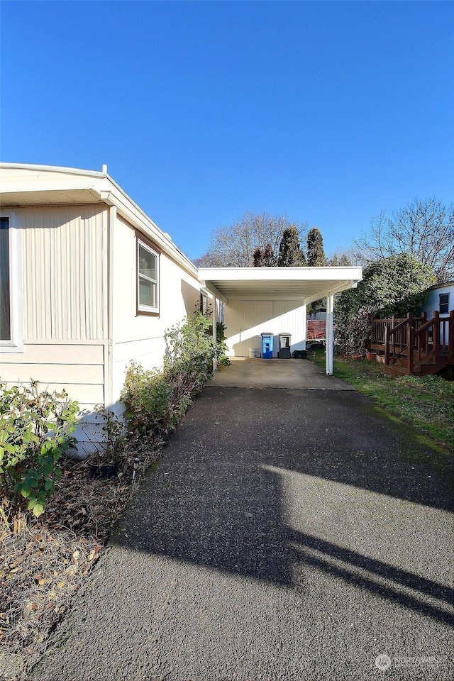 view of home's exterior with a carport