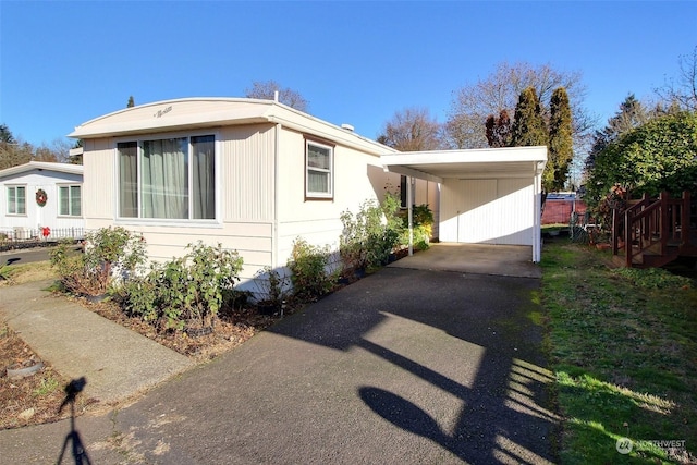 manufactured / mobile home with a carport