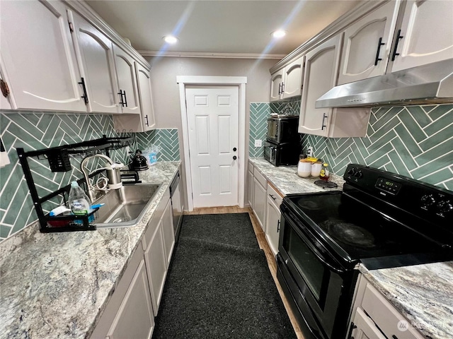 kitchen with black range with electric stovetop, white cabinetry, ornamental molding, and tasteful backsplash