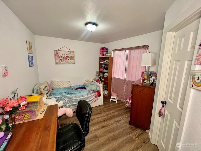 bedroom featuring dark wood-type flooring