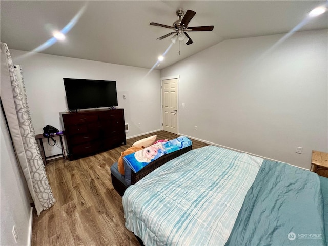 bedroom featuring lofted ceiling, wood-type flooring, and ceiling fan