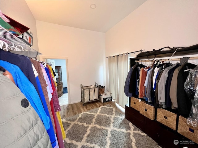 walk in closet featuring dark hardwood / wood-style flooring