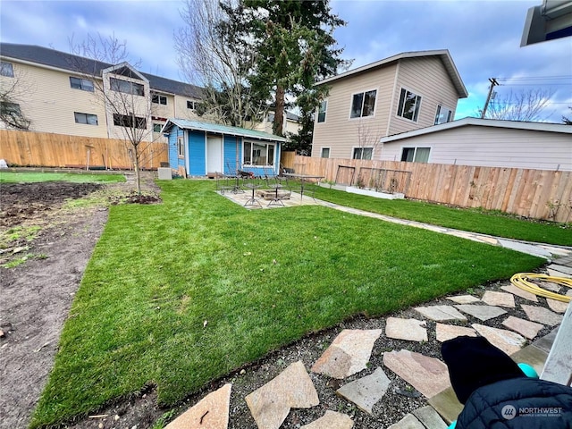 view of yard featuring an outbuilding and a patio area