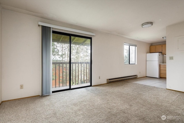 unfurnished living room with a baseboard radiator and light colored carpet