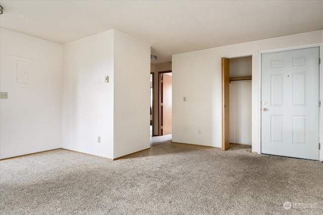 unfurnished bedroom featuring carpet floors and a closet