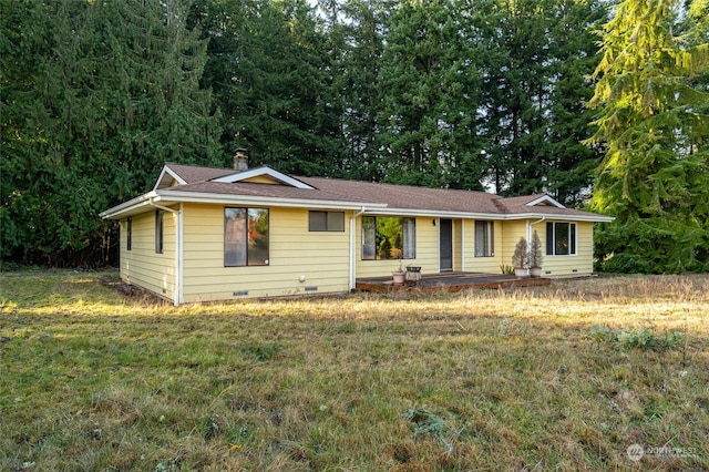 ranch-style home with a front yard