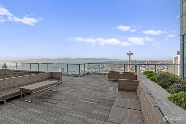 view of patio featuring a water view and outdoor lounge area