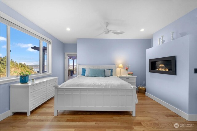 bedroom featuring light hardwood / wood-style flooring and ceiling fan