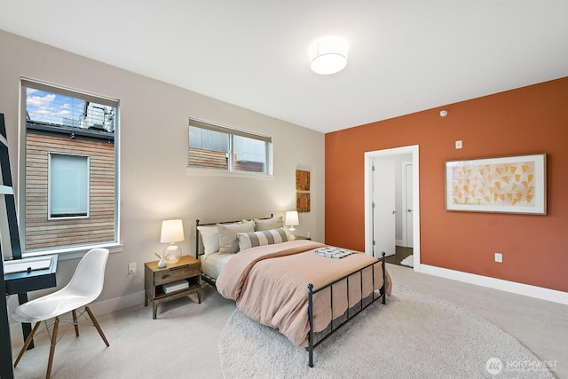 carpeted bedroom featuring baseboards