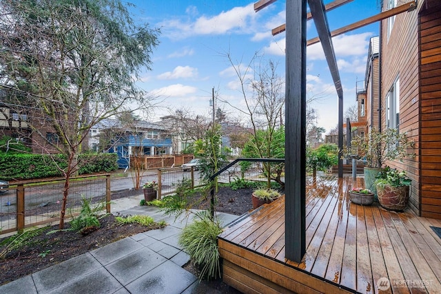 wooden terrace featuring a patio area