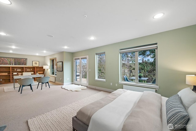 bedroom with access to exterior, recessed lighting, radiator, light carpet, and baseboards