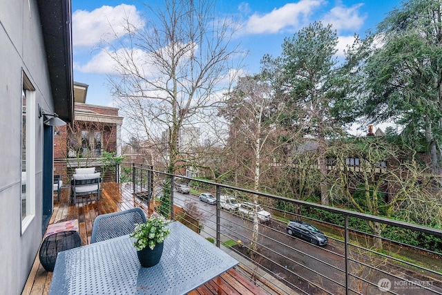 balcony featuring outdoor dining area