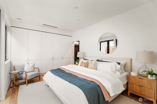 bedroom with light hardwood / wood-style flooring