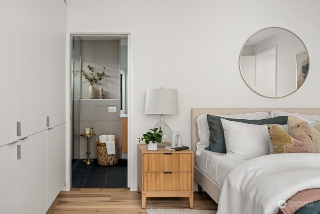 bedroom with light hardwood / wood-style floors