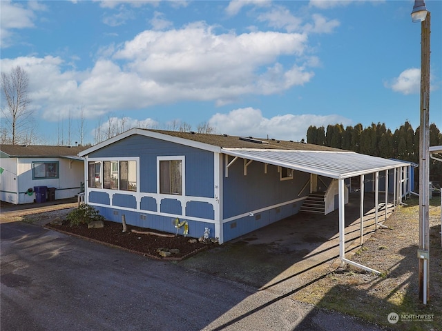 manufactured / mobile home featuring a carport