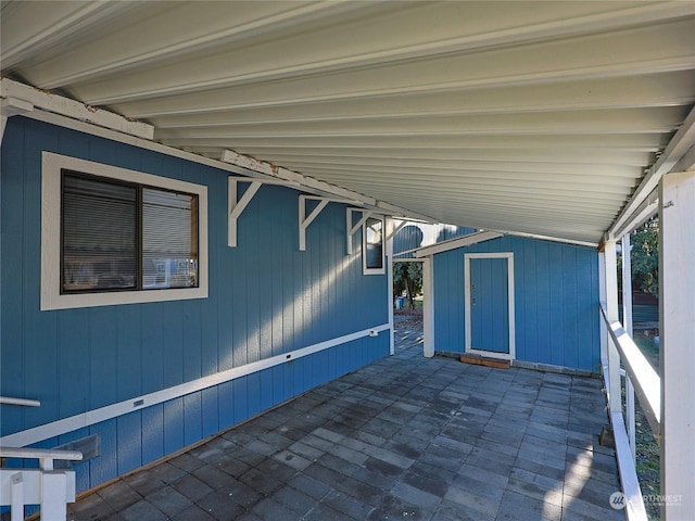 view of patio / terrace with a shed