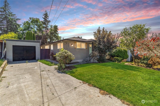 view of front of home featuring a yard and a garage