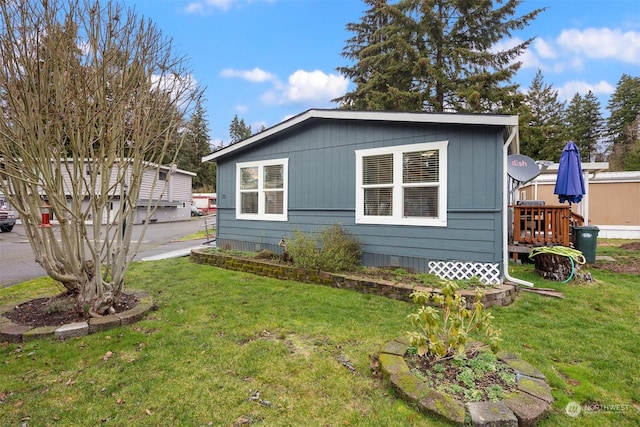 view of property exterior featuring a lawn