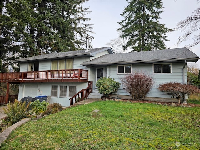 tri-level home featuring a deck and a front lawn