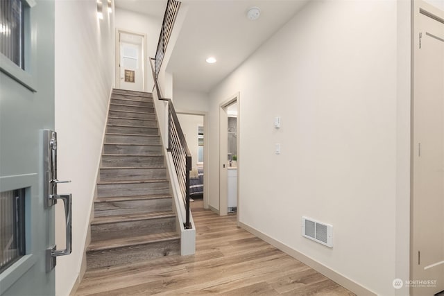 staircase featuring hardwood / wood-style floors