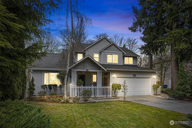 view of front of home with a garage, a porch, and a lawn