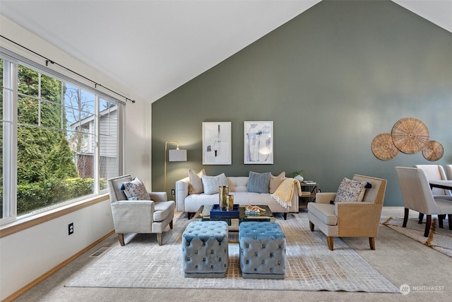 carpeted living room featuring vaulted ceiling