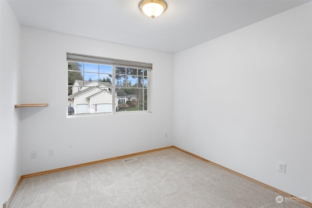 unfurnished room featuring carpet flooring