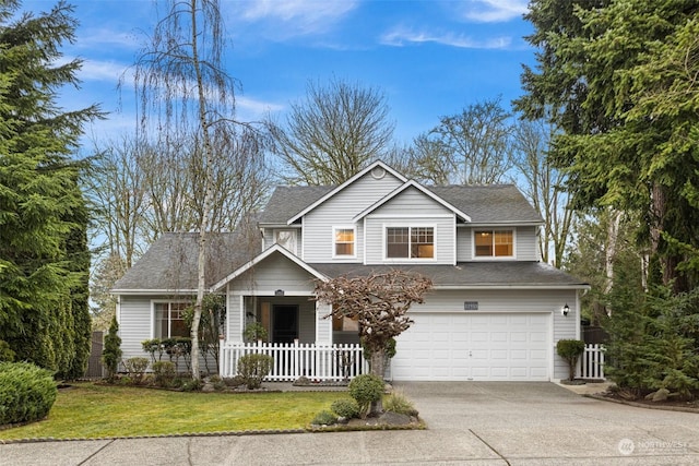 view of front of property featuring a garage and a front lawn