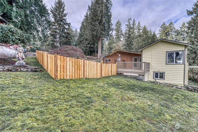 view of yard with a wooden deck