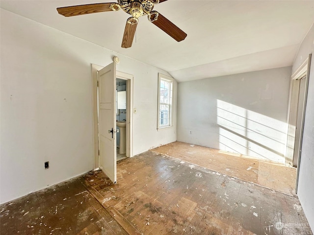 unfurnished room featuring vaulted ceiling and ceiling fan