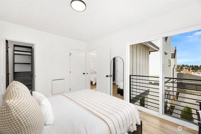 bedroom with light hardwood / wood-style floors