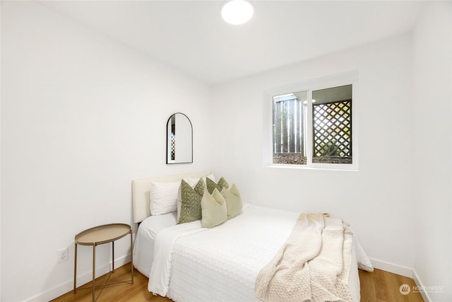 bedroom featuring hardwood / wood-style floors