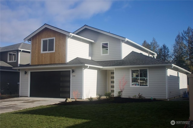 view of front facade with a front yard and a garage