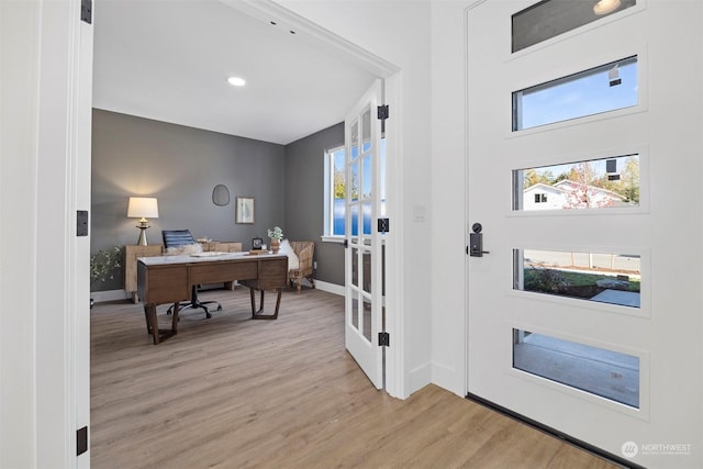 office area featuring light hardwood / wood-style flooring and french doors