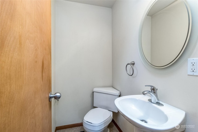 bathroom featuring sink and toilet