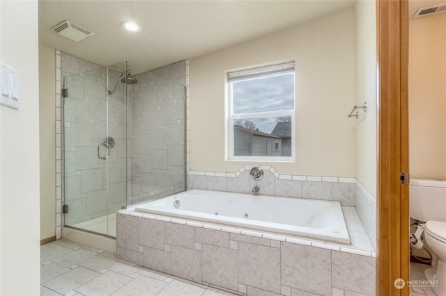 bathroom with toilet, tile patterned floors, and separate shower and tub