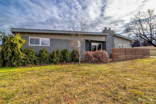 view of property exterior with a yard